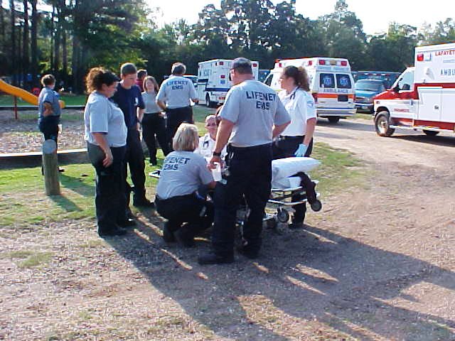 Emergency personnel on stand by with a stretcher.